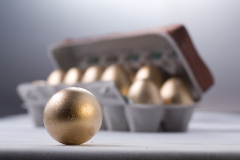 golden eggs in an egg carton